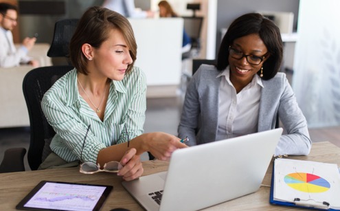 ladies looking at a laptop